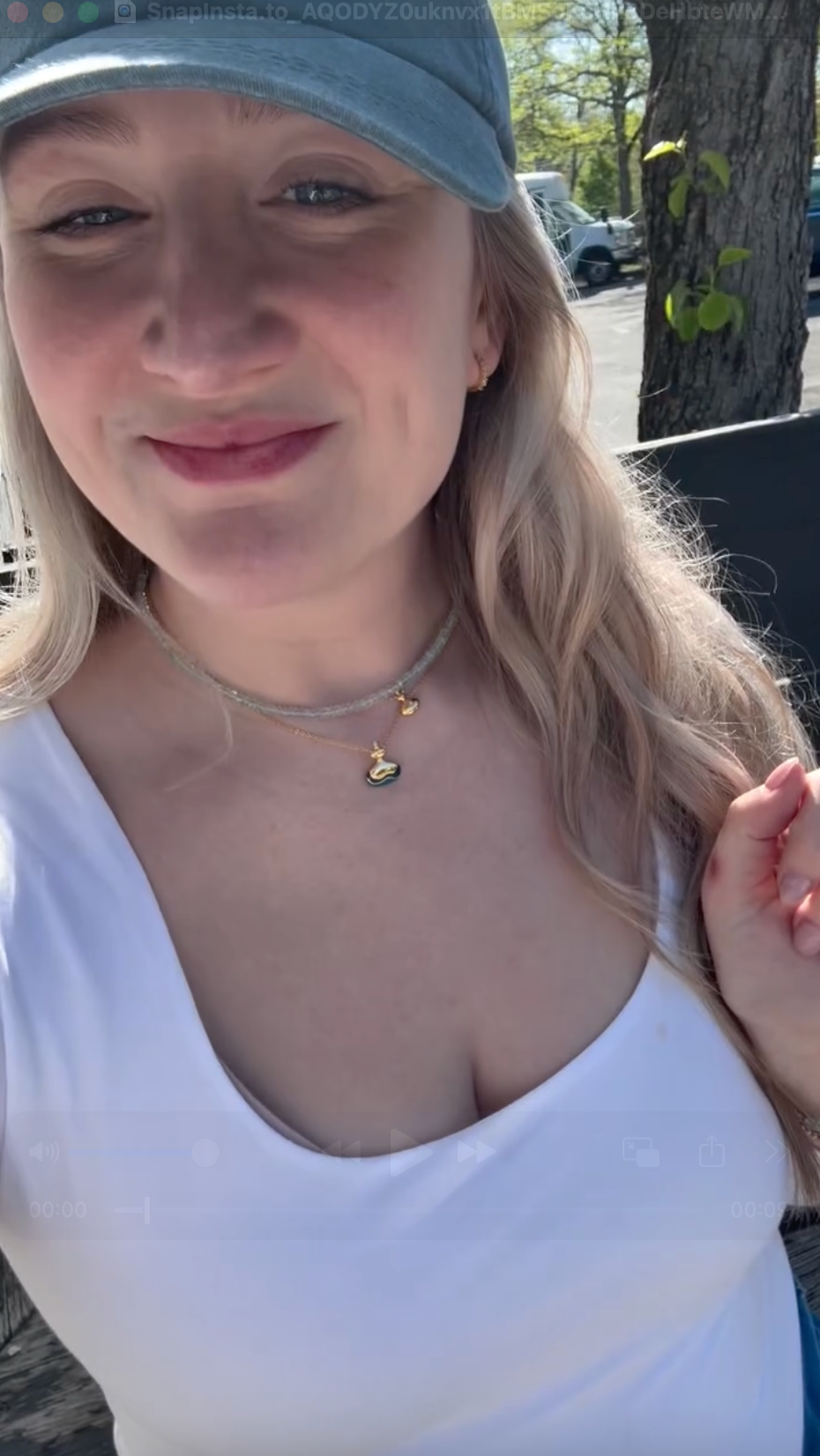 Customer selfie video showing layered BeamMore necklaces.