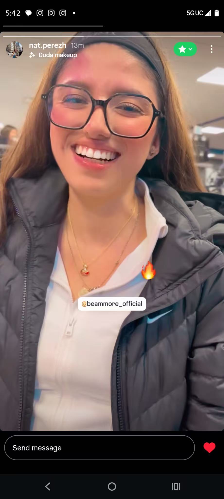 Close-up video of a customer styling a BeamMore necklace in natural light.