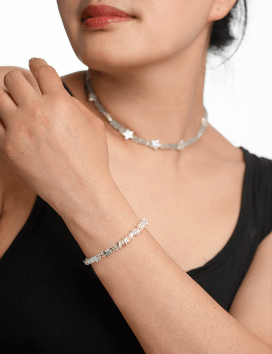 Model wearing BEAMMORE star-shaped pearl & aquamarine beaded gold-plated sterling silver necklace – Minimal, stackable style