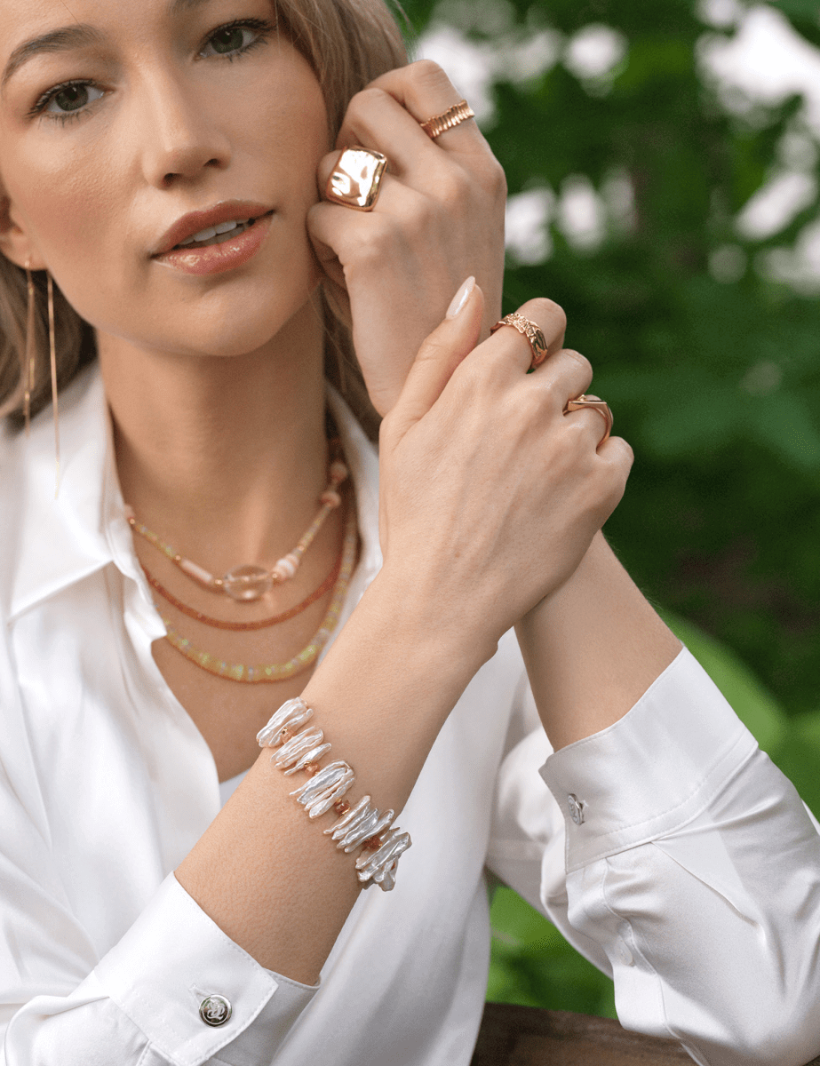 Model wearing BEAMMORE sunstone & elongated Biwa pearl beaded gold-plated sterling silver bracelet – Minimal, stackable style
