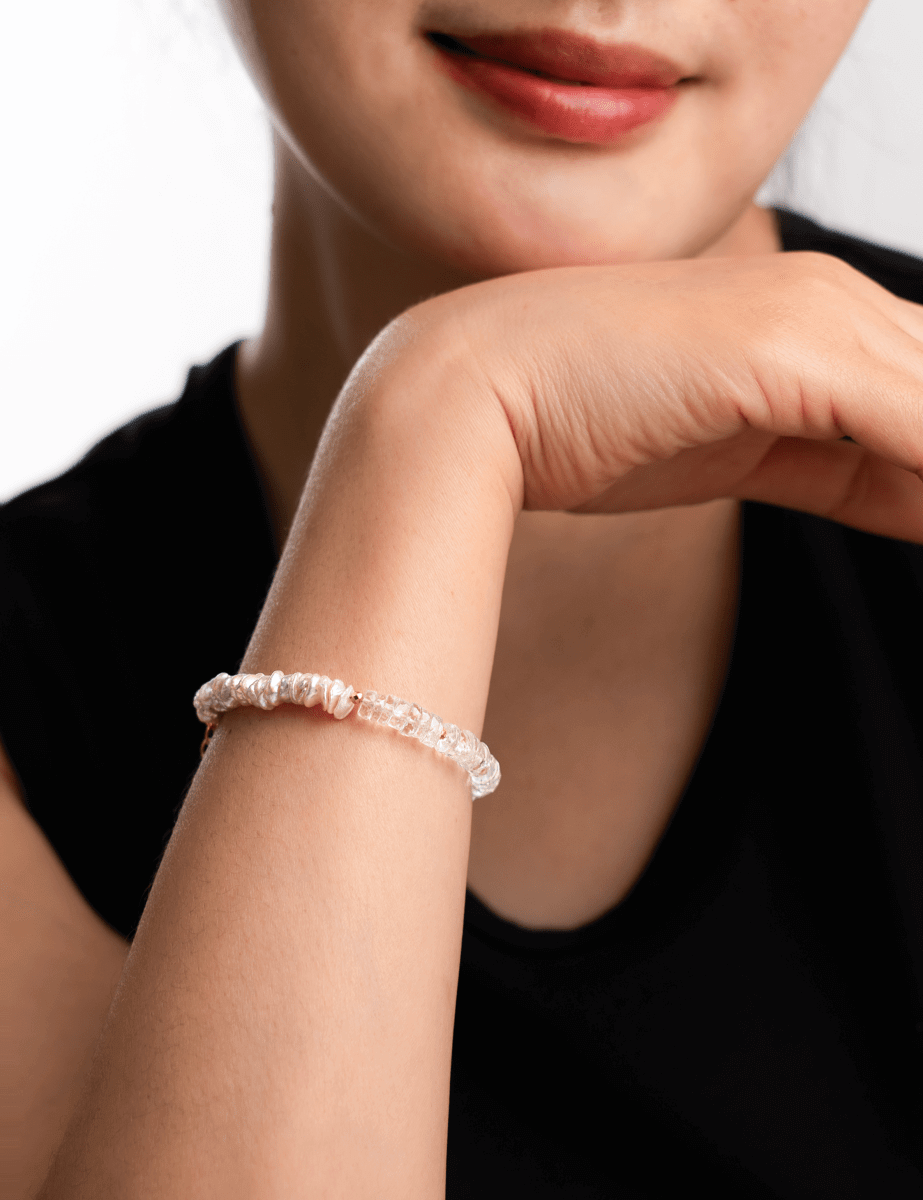 Model wearing BEAMMORE topaz & pearl beaded gold-plated sterling silver bracelet – Minimal, stackable style