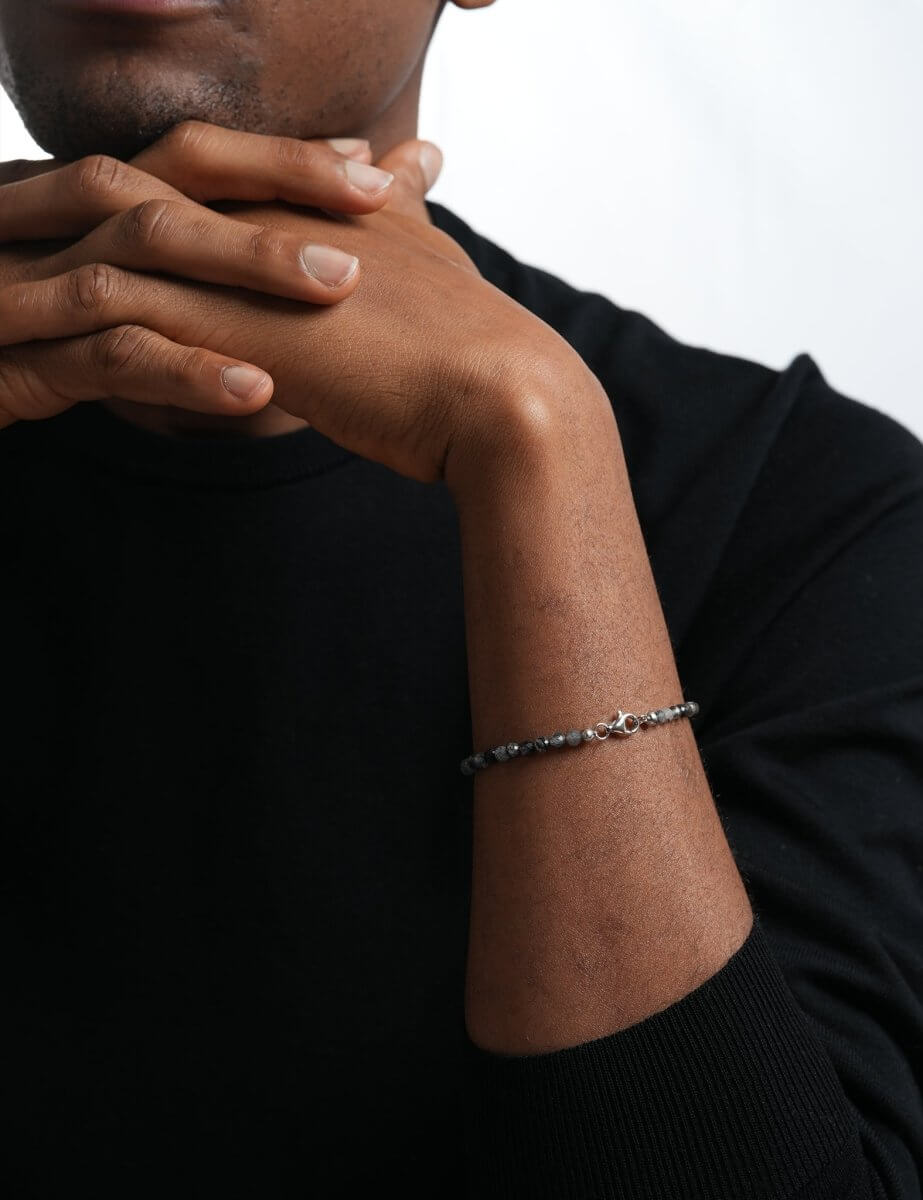 Model wearing BEAMMORE black rutilated quartz faceted 4mm bracelet – Clean, modern style