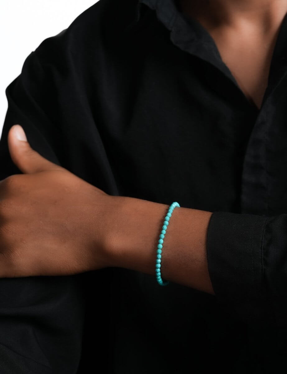 Model wearing BEAMMORE green turquoise faceted 4mm bracelet – Clean, modern style